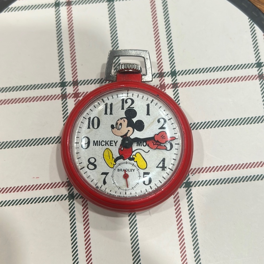 This is an authentic mickey mouse watch. All parts in order. Ticks! Adorable.